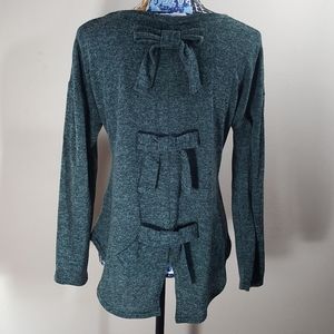 Green long sleeve shirt with bows down the back